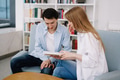 Attractive smiling happy skilled young couple of freelancers sitting at their workplace at home and Attractive smiling happy skilled young couple of freelancers sitting at their workplace at home and - PhotoDune Item for Sale