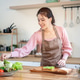 Asian woman putting vegetable on bread on wooden board making sandwich at kitchen cooking counter. Asian woman putting vegetable on bread on wooden board making sandwich at kitchen cooking counter. - PhotoDune Item for Sale