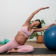 Pregnant Woman Performing Side Stretch With Stability Ball Pregnant Woman Performing Side Stretch With Stability Ball - PhotoDune Item for Sale
