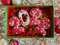 Flat lay overhead of homemade baked 2022 Christmas cookies on festive textured colorful background Flat lay overhead of homemade baked 2022 Christmas cookies on festive textured colorful background - PhotoDune Item for Sale