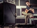 Man recording guitar tracks in a studio Man recording guitar tracks in a studio - PhotoDune Item for Sale