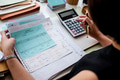 Adult asian woman working on payment bills accounting summary da Adult asian woman working on payment bills accounting summary da - PhotoDune Item for Sale