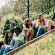 Diverse student friends talking and laughing on park stairs Diverse student friends talking and laughing on park stairs - PhotoDune Item for Sale