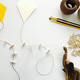 Craft project featuring DIY kites, string, wooden clothes pins, brushes, wooden elephant carving Craft project featuring DIY kites, string, wooden clothes pins, brushes, wooden elephant carving - PhotoDune Item for Sale