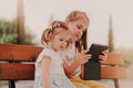 Two little girls sisters together and using gadget tablet pad. kids using technologies Two little girls sisters together and using gadget tablet pad. kids using technologies - PhotoDune Item for Sale