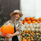 Autumn Portrait of a Woman with Pumpkins at a Pumpkin Fair Autumn Portrait of a Woman with Pumpkins at a Pumpkin Fair - PhotoDune Item for Sale