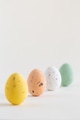 Four beautiful pastel colored chocolate Easter eggs, one pink egg sharp, on white background Four beautiful pastel colored chocolate Easter eggs, one pink egg sharp, on white background - PhotoDune Item for Sale