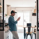Casual businessman using phone at home Casual businessman using phone at home - PhotoDune Item for Sale