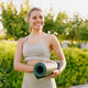 A passionate yoga enthusiast deeply enjoying the serene beauty of nature on their yoga mat A passionate yoga enthusiast deeply enjoying the serene beauty of nature on their yoga mat - PhotoDune Item for Sale