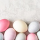 Easter eggs border on light grey background, colorful pastel dyed. Easter eggs border on light grey background, colorful pastel dyed. - PhotoDune Item for Sale