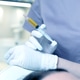 Plasma lifting - close-up of a doctor's hand in blue rubber gloves with a syringe Plasma lifting - close-up of a doctor's hand in blue rubber gloves with a syringe - PhotoDune Item for Sale