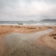 A freshwater stream meanders into the Vilela beach A freshwater stream meanders into the Vilela beach - PhotoDune Item for Sale