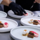 plated desserts in professional restaurant kitchen. chef arranges chocolate cake. plated desserts in professional restaurant kitchen. chef arranges chocolate cake. - PhotoDune Item for Sale