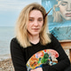 Adult female painter with palette and brush by sea featuring her realistic portrait artwork Adult female painter with palette and brush by sea featuring her realistic portrait artwork - PhotoDune Item for Sale