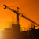 Silhouette construction site worker in a building site at sunset Silhouette construction site worker in a building site at sunset - PhotoDune Item for Sale
