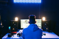 Man working in a modern technological sound and visual studio Man working in a modern technological sound and visual studio - PhotoDune Item for Sale
