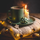 Christmas still life with mug of hot chocolate, candles and christmas lights on stack of knitted Christmas still life with mug of hot chocolate, candles and christmas lights on stack of knitted - PhotoDune Item for Sale