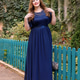 Woman in a long blue dress in the garden. Woman in a long blue dress in the garden. - PhotoDune Item for Sale