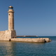 Historic lighthouse overlooking the tranquil waters of Rethymno in Crete, Greece Historic lighthouse overlooking the tranquil waters of Rethymno in Crete, Greece - PhotoDune Item for Sale