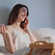 Carefree woman talking smartphone in home bed closeup. Casual lady calling Carefree woman talking smartphone in home bed closeup. Casual lady calling - PhotoDune Item for Sale