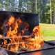 Flames erupting from barbecue grill in sunny backyard setting during summer Flames erupting from barbecue grill in sunny backyard setting during summer - PhotoDune Item for Sale