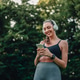 Woman exercising outdoors listening music on phone Woman exercising outdoors listening music on phone - PhotoDune Item for Sale