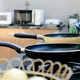 Frying pan on the stove in a modern kitchen. Frying pan on the stove in a modern kitchen. - PhotoDune Item for Sale