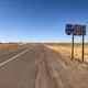 Open highway in rural Idaho with road signs under a clear blue sky Open highway in rural Idaho with road signs under a clear blue sky - PhotoDune Item for Sale
