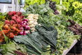 Assorted root and leafy vegetables displayed at a farmer’s market booth for a healthy background Assorted root and leafy vegetables displayed at a farmer’s market booth for a healthy background - PhotoDune Item for Sale