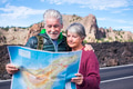 beautiful caucasian aged senior couple man and woman people traveling using old style paper map beautiful caucasian aged senior couple man and woman people traveling using old style paper map - PhotoDune Item for Sale