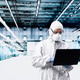 Technician man inspecting semiconductor production infrastructure with laptop Technician man inspecting semiconductor production infrastructure with laptop - PhotoDune Item for Sale