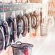 Row of industrial laundry machines in laundromat in a public laundromat, with laundry in a basket Row of industrial laundry machines in laundromat in a public laundromat, with laundry in a basket - PhotoDune Item for Sale
