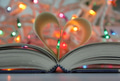 For the love of reading a heart made with book’s pages & bokeh Christmas lights on background. For the love of reading a heart made with book’s pages & bokeh Christmas lights on background. - PhotoDune Item for Sale