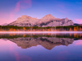 Mountain landscape at dawn. Alberta, Canada. Lake and forest in a mountain valley at dawn. Mountain landscape at dawn. Alberta, Canada. Lake and forest in a mountain valley at dawn. - PhotoDune Item for Sale