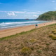 View to the Zarautz Beach with walking people, Basque Country, Spain on a beautiful summer day. View to the Zarautz Beach with walking people, Basque Country, Spain on a beautiful summer day. - PhotoDune Item for Sale