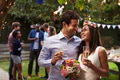 Young Couple Celebrating Wedding With Party In Backyard Young Couple Celebrating Wedding With Party In Backyard - PhotoDune Item for Sale