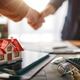Real Estate Deal Closing Handshake with Miniature House on Office Desk, Home Purchase Agreement Real Estate Deal Closing Handshake with Miniature House on Office Desk, Home Purchase Agreement - PhotoDune Item for Sale