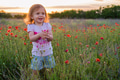 Cute happy child girl in poppy field. Happy childhood concept Cute happy child girl in poppy field. Happy childhood concept - PhotoDune Item for Sale