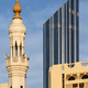 Traditional minaret of the mosque against modern buildings in Abu Dhabi, UAE Traditional minaret of the mosque against modern buildings in Abu Dhabi, UAE - PhotoDune Item for Sale