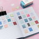 Crafting journal with decorative paper stamps and hole puncher Crafting journal with decorative paper stamps and hole puncher - PhotoDune Item for Sale