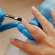 Manicurist paints nails with gel polish. Application of acrylic polish on nails. Manicurist paints nails with gel polish. Application of acrylic polish on nails. - PhotoDune Item for Sale