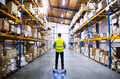 Male warehouse worker on hoverboard. Male warehouse worker on hoverboard. - PhotoDune Item for Sale