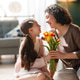 Joyful Mother and Daughter Sharing Tulips at Home, Celebrating Love and Family Joyful Mother and Daughter Sharing Tulips at Home, Celebrating Love and Family - PhotoDune Item for Sale