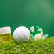 Golf ball for St. Patrick's Day with beer on green Golf ball for St. Patrick's Day with beer on green - PhotoDune Item for Sale