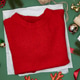 Red sweater on Christmas background Red sweater on Christmas background - PhotoDune Item for Sale