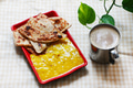 Roti Paratha with Dhal curry served with a cup of milk coffee Roti Paratha with Dhal curry served with a cup of milk coffee - PhotoDune Item for Sale