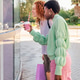 two happy young women standing outside a store two happy young women standing outside a store - PhotoDune Item for Sale