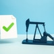 An oil pump and a document with a green checkmark. Production license. Oil futures contract. An oil pump and a document with a green checkmark. Production license. Oil futures contract. - PhotoDune Item for Sale