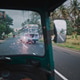 Tuk-tuks and bus on a scenic road under clouded sky Tuk-tuks and bus on a scenic road under clouded sky - PhotoDune Item for Sale