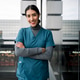 Healthcare professional woman smiling, arms crossed in city Healthcare professional woman smiling, arms crossed in city - PhotoDune Item for Sale